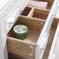 Open drawer of Eiffel 24'' High Gloss White Vanity with organized wooden compartments containing personal care items.